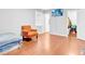 Bedroom featuring neutral walls, window and wood floor at 1563 Greenwood Dr, Norcross, GA 30093