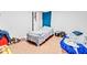 Small bedroom with neutral walls and wood flooring at 1563 Greenwood Dr, Norcross, GA 30093