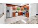 Spacious kitchen featuring granite countertops, stainless steel appliances, and ample cabinet space at 1563 Greenwood Dr, Norcross, GA 30093