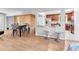 Spacious living area seamlessly blends with kitchen; modern furnishings and wood flooring throughout at 1563 Greenwood Dr, Norcross, GA 30093