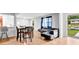Bright living area boasts sleek wood floors, modern furnishings, and a large window offering lots of natural light at 1563 Greenwood Dr, Norcross, GA 30093