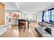 Open concept living and dining area with hardwood floors and view of the kitchen at 1563 Greenwood Dr, Norcross, GA 30093