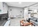 Combined living and dining areas with tile floors, neutral walls, and modern furnishings at 1563 Greenwood Dr, Norcross, GA 30093