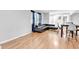 Bright living area boasts sleek wood floors, modern furnishings, and a large window offering lots of natural light at 1563 Greenwood Dr, Norcross, GA 30093