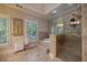 Bright bathroom with a glass shower, bathtub, shuttered windows, and tiled floors at 3127 Lenox Ne Rd # 1, Atlanta, GA 30324