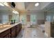 Luxurious bathroom with dual sinks, a soaking tub, and a glass-enclosed shower at 3127 Lenox Ne Rd # 1, Atlanta, GA 30324