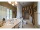Well-lit bathroom featuring a vanity, toilet, and shower with decorative curtain at 3127 Lenox Ne Rd # 1, Atlanta, GA 30324