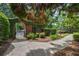Beautiful community entrance with brick walls, wrought iron gate and a sidewalk at 3127 Lenox Ne Rd # 1, Atlanta, GA 30324