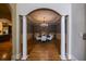 Open dining room with hardwood floors, classic archways, and stylish lighting at 3127 Lenox Ne Rd # 1, Atlanta, GA 30324