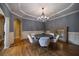 Chic dining space with hardwood floors, chandelier and large framed mirror at 3127 Lenox Ne Rd # 1, Atlanta, GA 30324