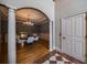 Dining room featuring hardwood floors, a chandelier, columns, and a large framed mirror at 3127 Lenox Ne Rd # 1, Atlanta, GA 30324