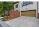 Exterior view of a driveway leading to a two-car garage with a brick wall entrance at 3127 Lenox Ne Rd # 1, Atlanta, GA 30324