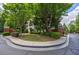 Charming exterior view showcases lush landscaping, mature trees, and a well-maintained lawn, adding curb appeal at 3127 Lenox Ne Rd # 1, Atlanta, GA 30324