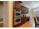 Kitchen with stainless steel ovens and plenty of wood cabinets for storage and convenient desk space at 3127 Lenox Ne Rd # 1, Atlanta, GA 30324
