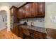 Kitchen desk with wooden cabinets, granite countertops, and stainless steel double wall oven at 3127 Lenox Ne Rd # 1, Atlanta, GA 30324