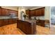 Gourmet kitchen with a center island, wooden cabinets, and a built-in desk at 3127 Lenox Ne Rd # 1, Atlanta, GA 30324