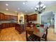 Open kitchen and living area features an island, hardwood floors, stainless appliances, and plenty of light at 3127 Lenox Ne Rd # 1, Atlanta, GA 30324
