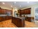 Gourmet kitchen with a center island, wooden cabinets, and a built-in desk at 3127 Lenox Ne Rd # 1, Atlanta, GA 30324