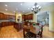 Open kitchen and living area features an island, hardwood floors, stainless appliances, and plenty of light at 3127 Lenox Ne Rd # 1, Atlanta, GA 30324
