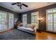 Bright living room features hardwood floors, large windows, a stylish gray sofa, and modern decor at 3127 Lenox Ne Rd # 1, Atlanta, GA 30324