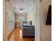 Bright living room with hardwood floors and a comfortable gray sofa near shuttered windows at 3127 Lenox Ne Rd # 1, Atlanta, GA 30324