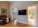 Bright main bedroom boasts hardwood floors, plantation shutters, and a wall-mounted TV at 3127 Lenox Ne Rd # 1, Atlanta, GA 30324