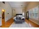 Spacious main bedroom with hardwood floors, a gray sofa, plantation shutters, and a vaulted ceiling at 3127 Lenox Ne Rd # 1, Atlanta, GA 30324