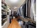Walk-in closet features custom shelving and hanging storage, offering ample space for organization at 3127 Lenox Ne Rd # 1, Atlanta, GA 30324