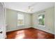 Cozy bedroom with hardwood floors, ceiling fan, and natural light from two windows at 865 Ashland Ne Ave, Atlanta, GA 30307