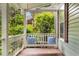 Relax on the covered front porch swing with decorative pillows at 865 Ashland Ne Ave, Atlanta, GA 30307