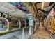 Intricate graffiti art covers the walls and pillars of this unique tunnel at 865 Ashland Ne Ave, Atlanta, GA 30307