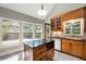 Bright kitchen with wood cabinets, granite countertops, stainless steel appliances, and view of deck at 865 Ashland Ne Ave, Atlanta, GA 30307