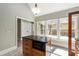 Kitchen island with granite countertop and microwave, and view of outdoor deck through large window at 865 Ashland Ne Ave, Atlanta, GA 30307