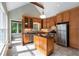Sunlit kitchen with stainless steel appliances, granite countertops, breakfast island, and outdoor access at 865 Ashland Ne Ave, Atlanta, GA 30307
