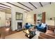 Cozy living room with decorative fireplace and exposed beam ceiling at 865 Ashland Ne Ave, Atlanta, GA 30307