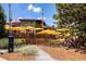 Outdoor seating area with yellow umbrellas, offering a pleasant dining experience for patrons at 865 Ashland Ne Ave, Atlanta, GA 30307
