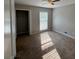 Bright bedroom with carpeting and a large window at 1231 Providence Way, Lawrenceville, GA 30046