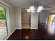 Dining room featuring chandelier and sliding doors to deck at 1231 Providence Way, Lawrenceville, GA 30046
