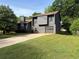 Charming two-story home with attached garage and mature landscaping at 1231 Providence Way, Lawrenceville, GA 30046