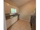 Clean kitchen with white cabinets and stainless steel appliances at 1231 Providence Way, Lawrenceville, GA 30046