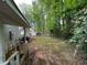 View from porch overlooks private backyard with lush trees, offering a peaceful retreat at 2036 Countydown Ln, Stone Mountain, GA 30088