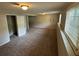 Large basement with plush carpeting, natural light, and a neutral color palette at 2036 Countydown Ln, Stone Mountain, GA 30088