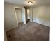 Neutral bedroom with plush carpet features a spacious closet at 2036 Countydown Ln, Stone Mountain, GA 30088
