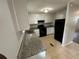 A lovely kitchen with granite countertops and white cabinets at 2036 Countydown Ln, Stone Mountain, GA 30088