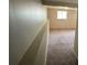 Carpeted living room includes a window letting in natural light at 2036 Countydown Ln, Stone Mountain, GA 30088