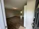 A welcoming view into a bright and airy living room with wood floors and neutral walls at 2036 Countydown Ln, Stone Mountain, GA 30088