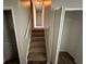 A carpeted staircase leads to the upper level at 2036 Countydown Ln, Stone Mountain, GA 30088
