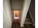 Carpeted stairs leading down, framed by doorways and light at 2036 Countydown Ln, Stone Mountain, GA 30088