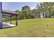 Spacious backyard with a covered patio, perfect for outdoor entertaining and relaxing at 37 Deer Canyon Dr, Auburn, GA 30011