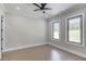 Bright bedroom with ample natural light coming from two large windows at 37 Deer Canyon Dr, Auburn, GA 30011